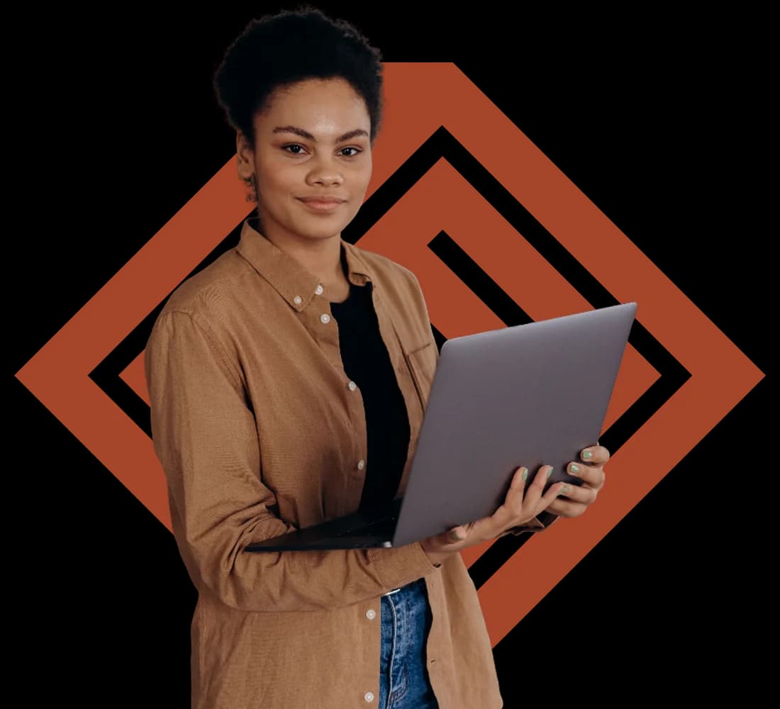 A Dancode Africa engineer holding a laptop, smiling